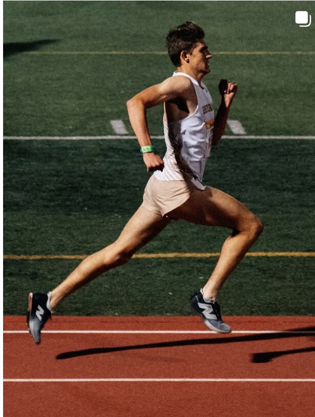 Sprinter at full stride on the runway